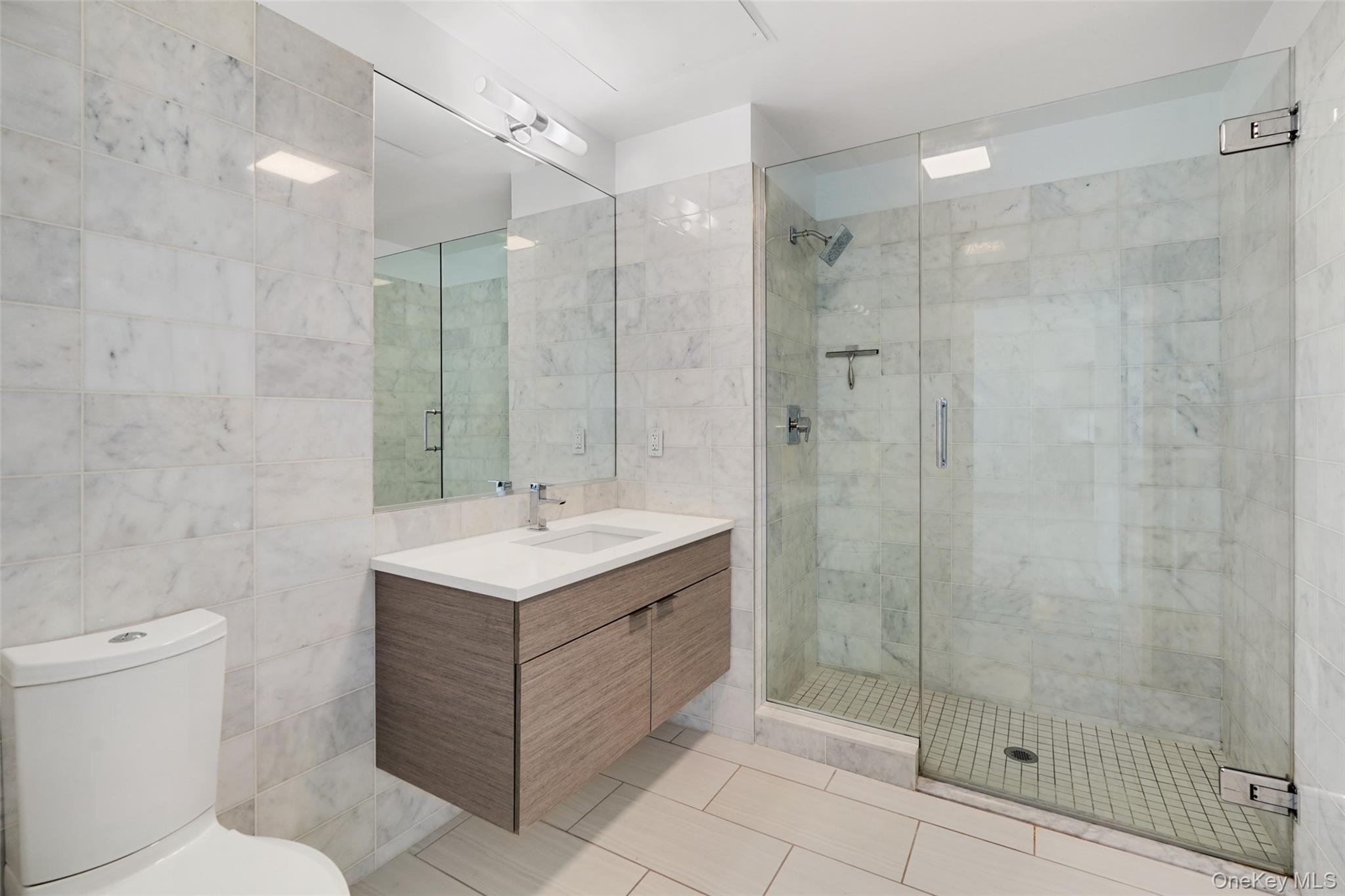 2 2nd Street, Unit 26 Rye, NY 10580 - Photo 4 of 8 a bathroom with a sink toilet and shower