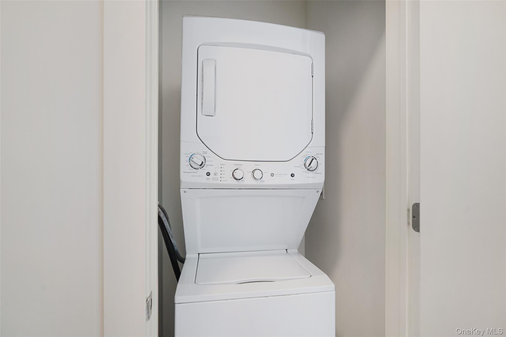 2 2nd Street, Unit 26 Rye, NY 10580 - Photo 7 of 8 a utility room with dryer and washer