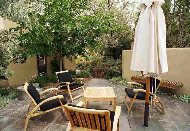 15 Sawbuck Road Reno, NV 89519 - Photo 4 of 5 a view of a patio with table and chairs and potted plants