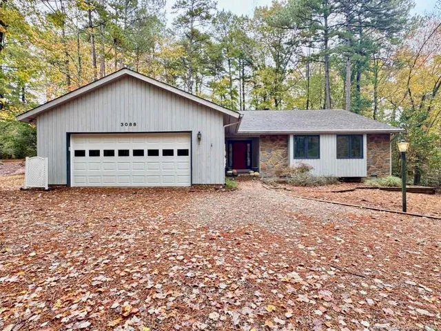 a house with trees in the background