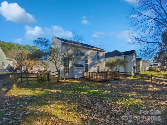 a view of a yard with a house in the background