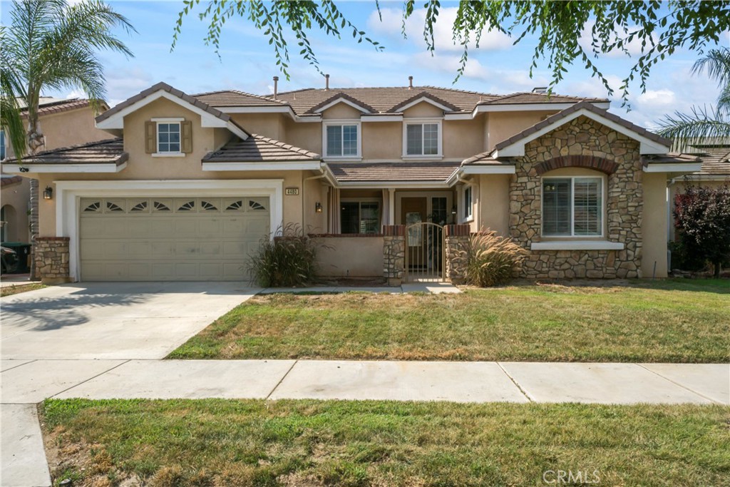 4480 Cloudywing Road Hemet, CA 92545 - Photo 1 of 1 a front view of a house with garden