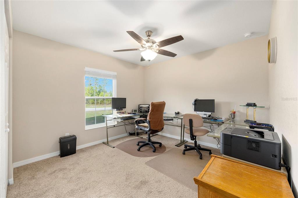 13057 Southwest 85th Circle Ocala, FL 34473 - Photo 15 of 34 a view of a workspace with furniture and a window