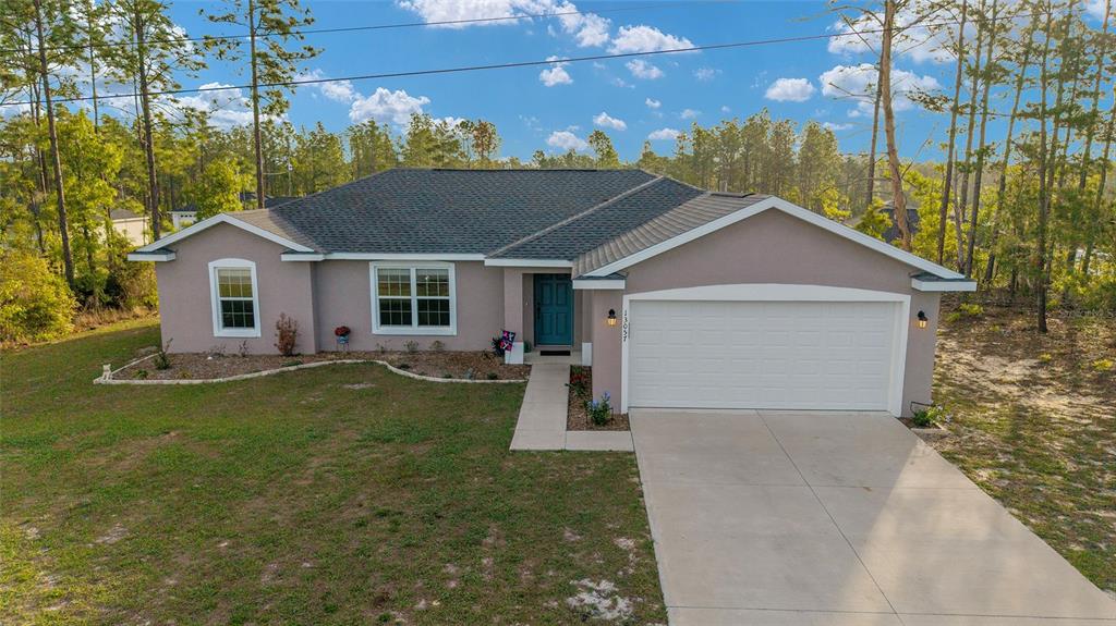 13057 Southwest 85th Circle Ocala, FL 34473 - Photo 25 of 34 a view of a house with a yard and fence