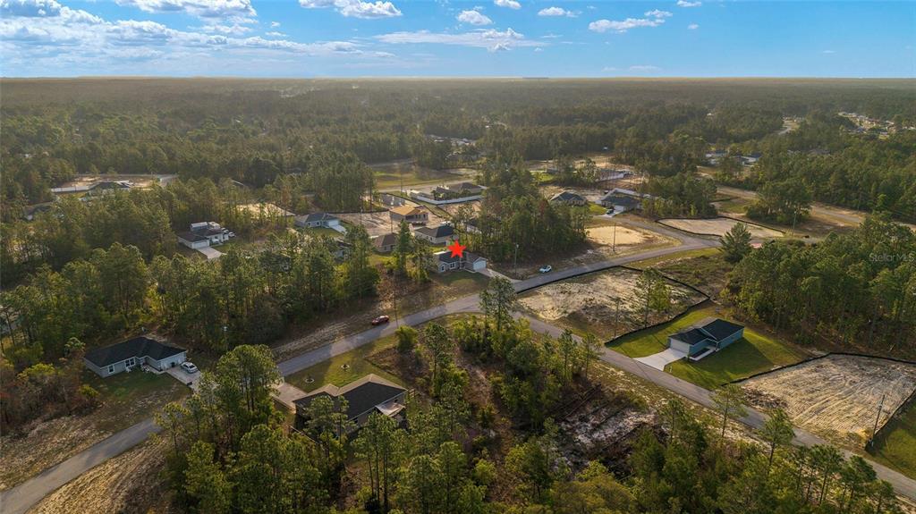 13057 Southwest 85th Circle Ocala, FL 34473 - Photo 28 of 34 an aerial view of residential houses with outdoor space