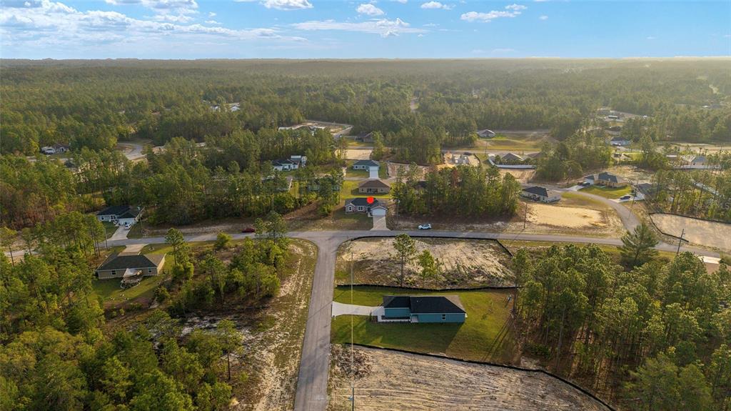 13057 Southwest 85th Circle Ocala, FL 34473 - Photo 29 of 34 an aerial view of residential houses with outdoor space