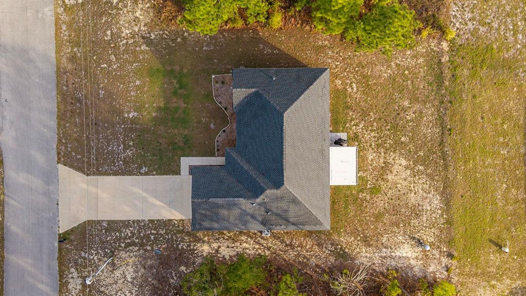 13057 Southwest 85th Circle Ocala, FL 34473 - Photo 31 of 34 a brick house with a yard