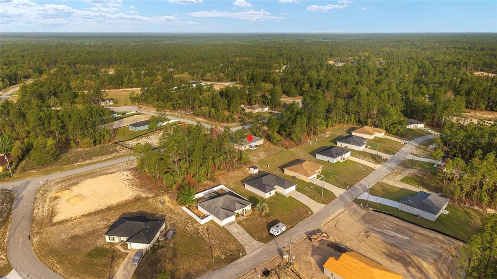 13057 Southwest 85th Circle Ocala, FL 34473 - Photo 33 of 34 an aerial view of residential houses with outdoor space