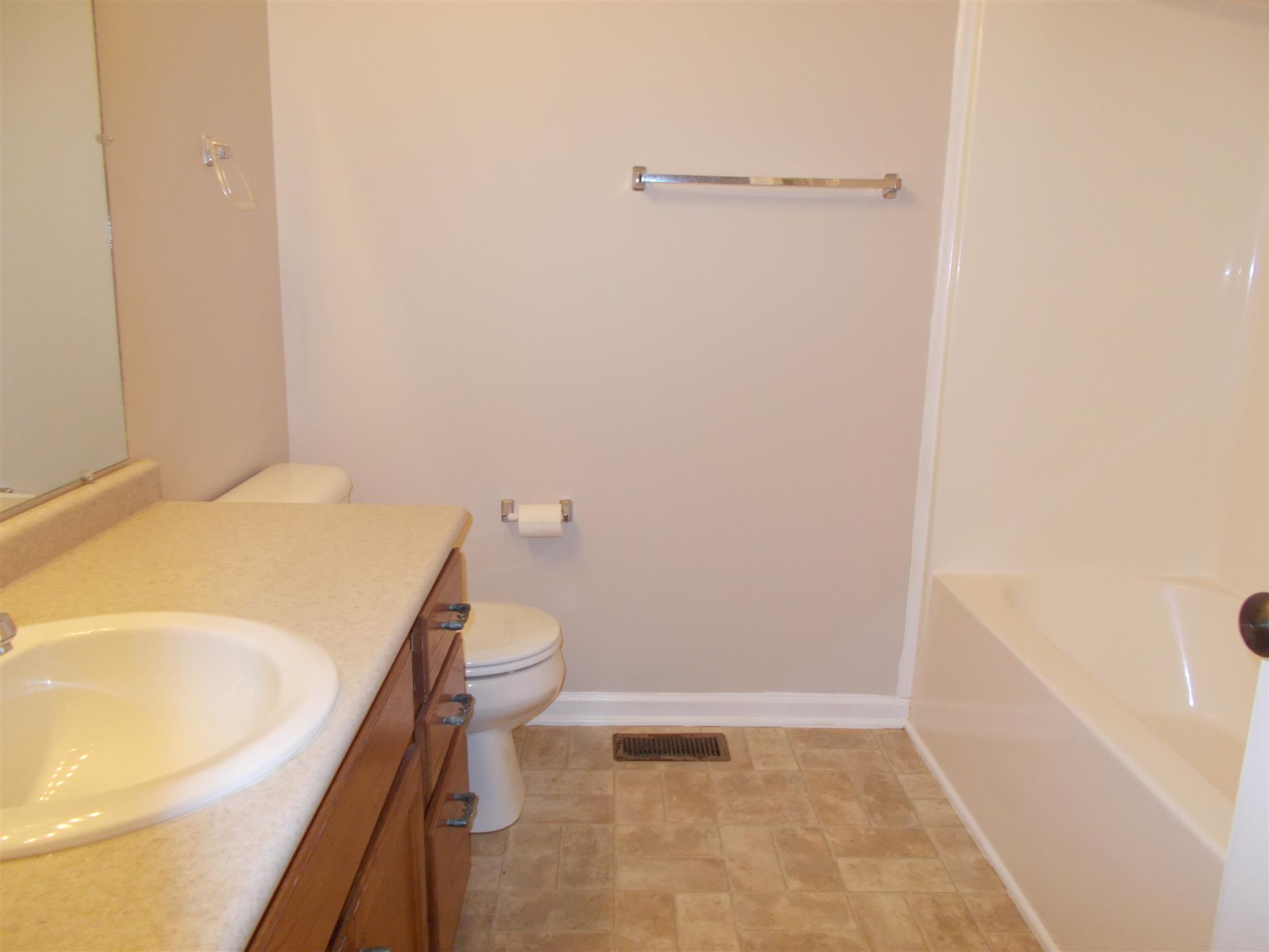 3398 Queensbury Road Clarksville, TN 37042 - Photo 11 of 26 a bathroom with a sink a toilet and tub