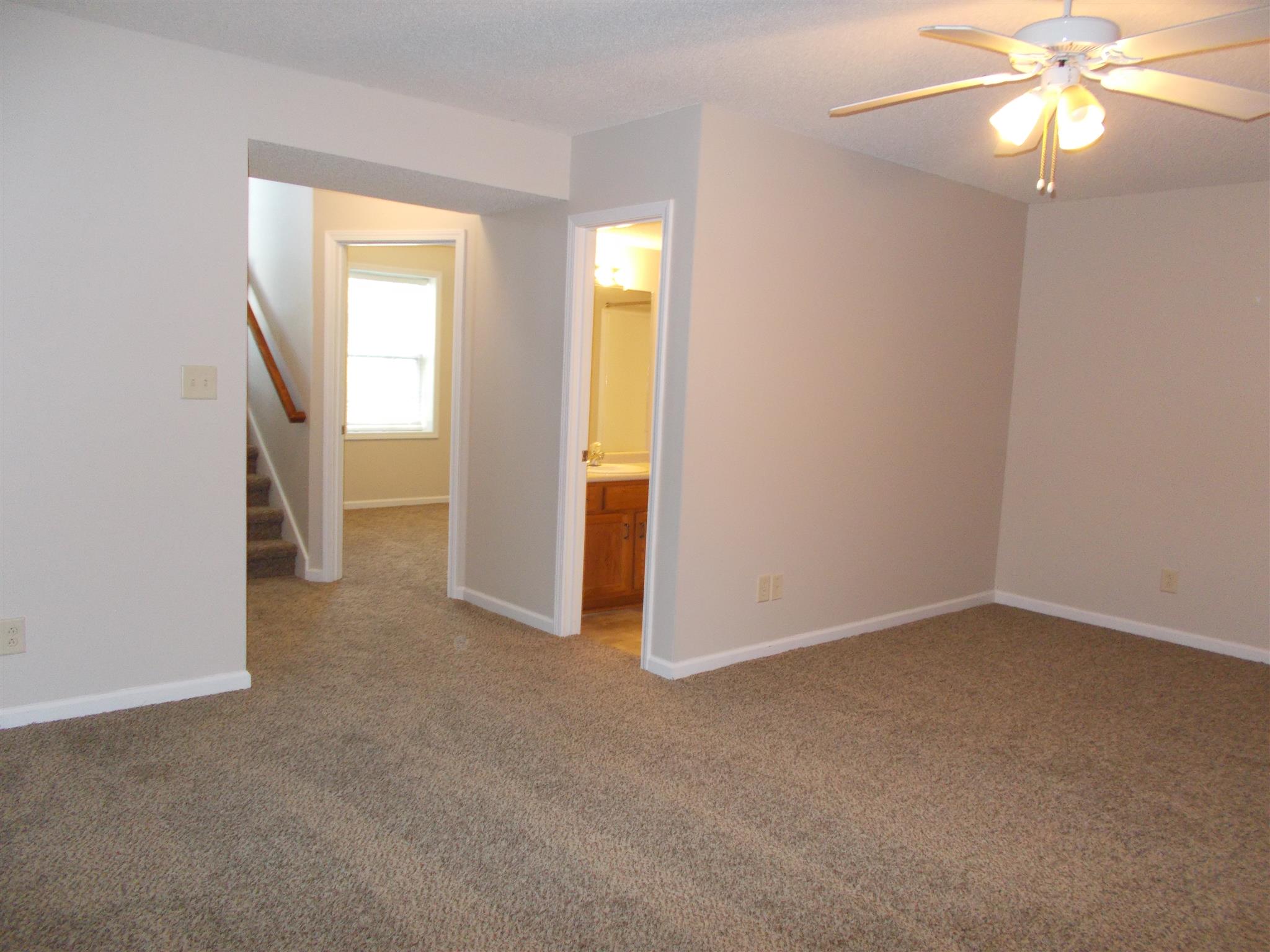 3398 Queensbury Road Clarksville, TN 37042 - Photo 21 of 26 an empty room with closet and a chandelier fan