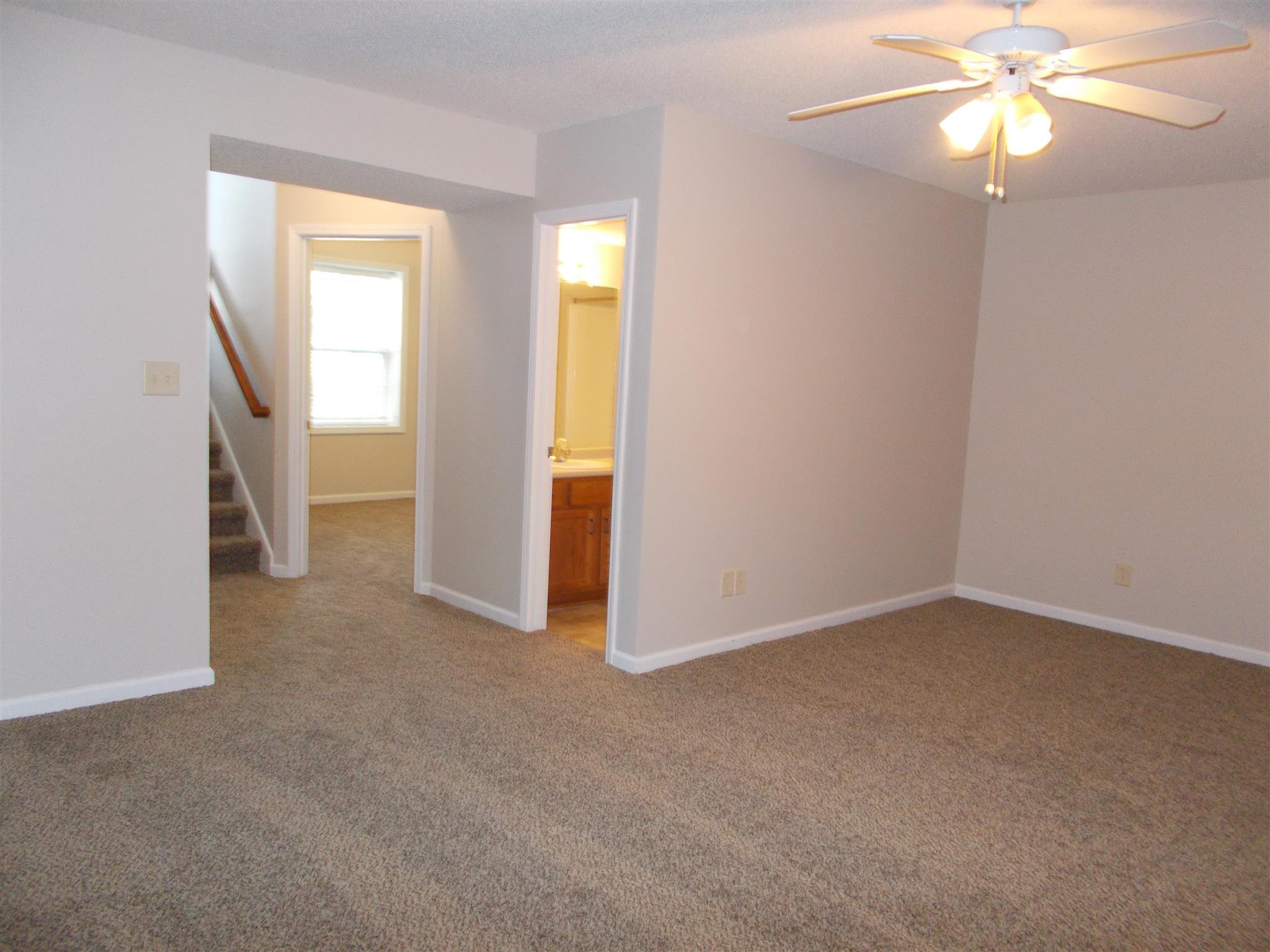3398 Queensbury Road Clarksville, TN 37042 - Photo 23 of 26 an empty room with windows and fan