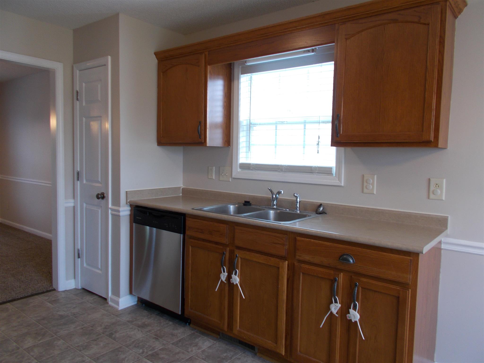 3398 Queensbury Road Clarksville, TN 37042 - Photo 6 of 26 a kitchen with a sink cabinets and a window