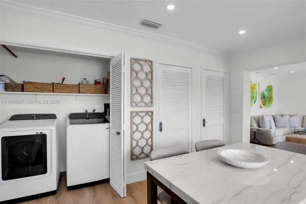 a view of a house with a wooden deck and a yard