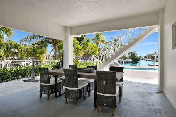 a bedroom with a bed and a night stand