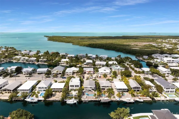 a bedroom with bed and painting on the wall