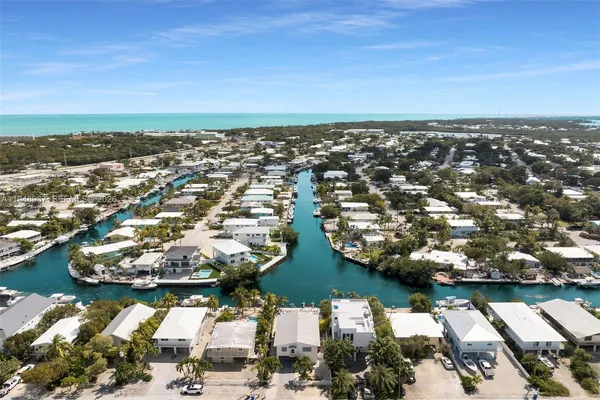 a bedroom with a bed and a table in it
