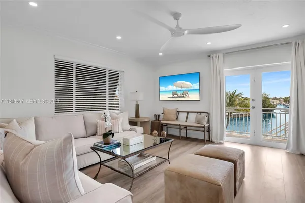 a kitchen with stainless steel appliances a stove a sink a microwave and cabinets