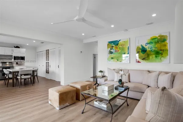 a bathroom with a granite countertop sink a toilet and a mirror