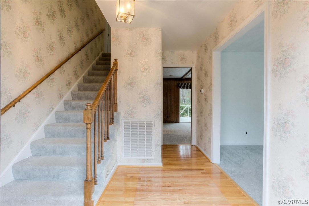 12901 Middlebrook Road Chester, VA 23831 - Photo 2 of 38 a view of a hallway with wooden floor and staircase