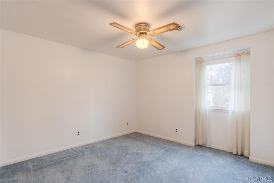 12901 Middlebrook Road Chester, VA 23831 - Photo 29 of 38 an empty room with windows and fan