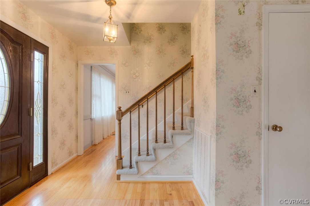 12901 Middlebrook Road Chester, VA 23831 - Photo 3 of 38 a view of a hallway with wooden floor and staircase
