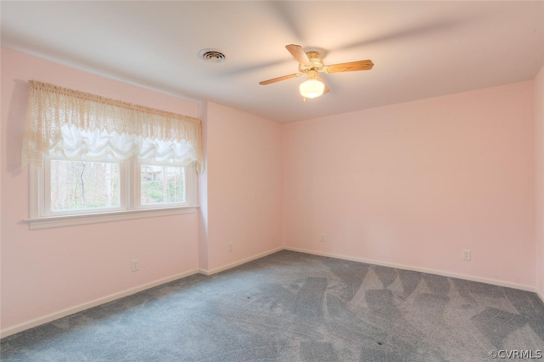 12901 Middlebrook Road Chester, VA 23831 - Photo 31 of 38 an empty room with windows and fan