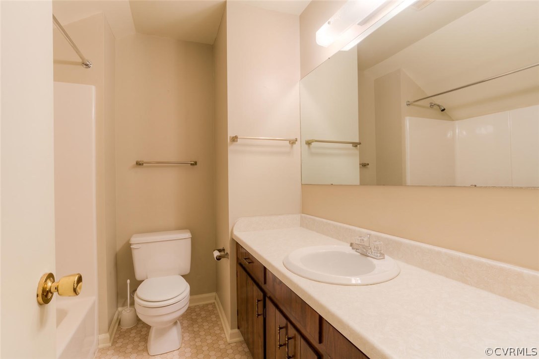 12901 Middlebrook Road Chester, VA 23831 - Photo 35 of 38 a bathroom with a sink a toilet and a mirror
