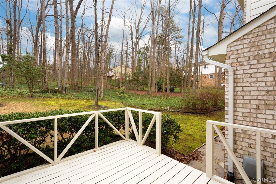 12901 Middlebrook Road Chester, VA 23831 - Photo 36 of 38 a view of a balcony with two chairs next to a yard