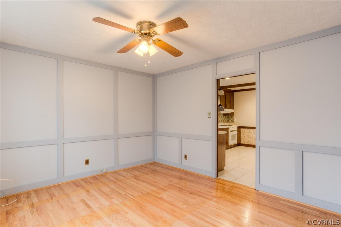 12901 Middlebrook Road Chester, VA 23831 - Photo 4 of 38 a bedroom with a bed and a chandelier