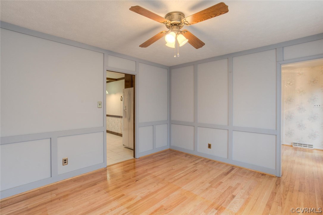 12901 Middlebrook Road Chester, VA 23831 - Photo 6 of 38 wooden floor in an empty room with a window