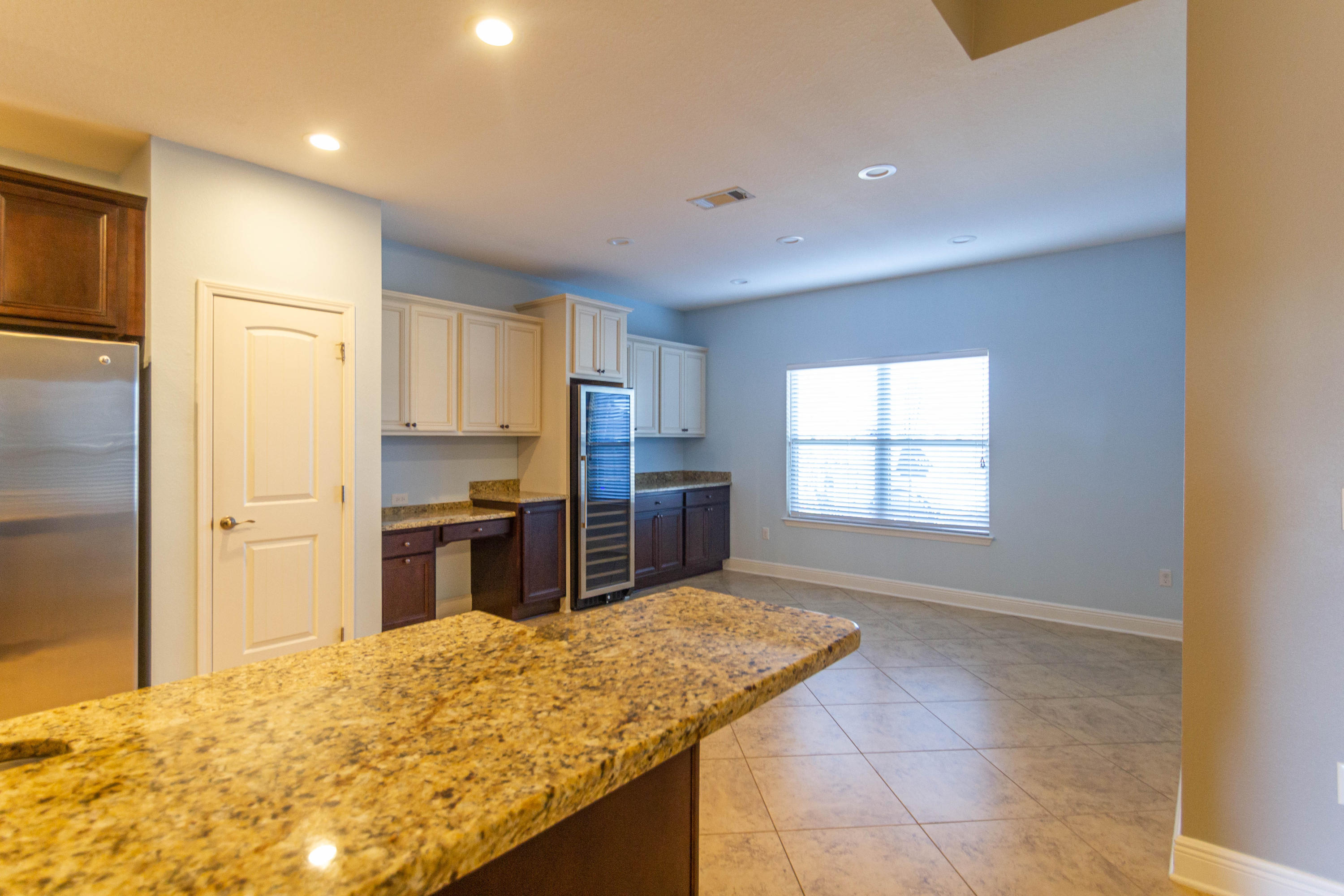 530 Pin Oak Loop Santa Rosa Beach, FL 32459 - Photo 3 of 53 a kitchen with stainless steel appliances granite countertop a refrigerator and a sink