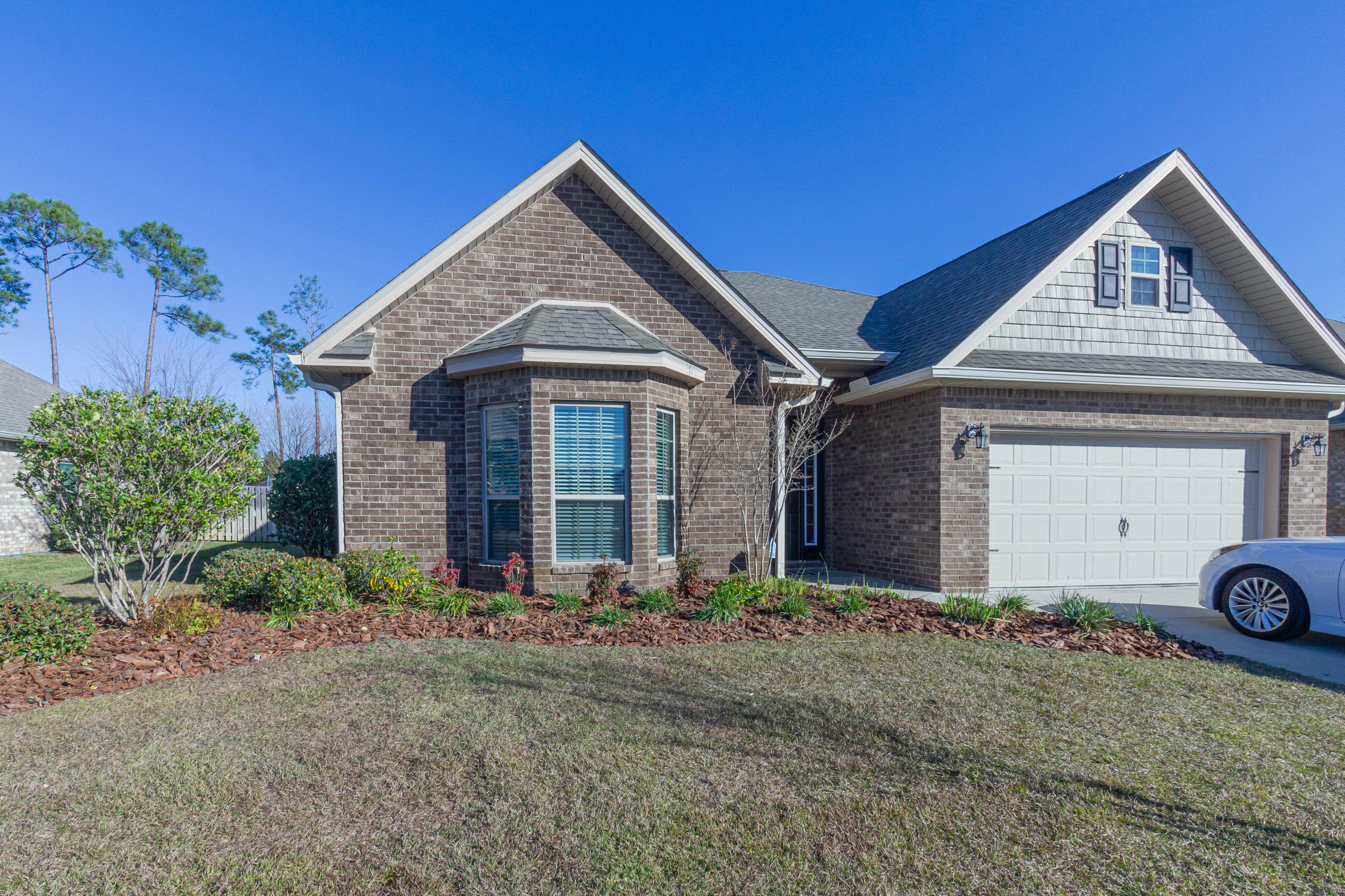 530 Pin Oak Loop Santa Rosa Beach, FL 32459 - Photo 50 of 53 a front view of a house with garden