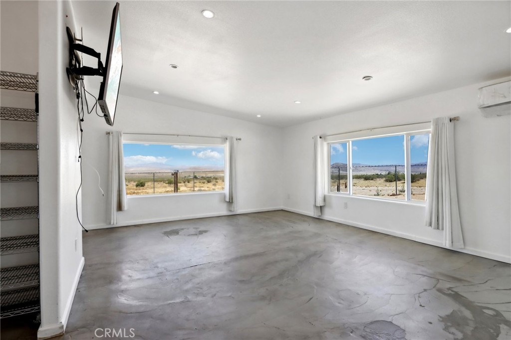 51474 Mills Road Johnson Valley, CA 92285 - Photo 12 of 56 a view of an empty room with a window and a fireplace