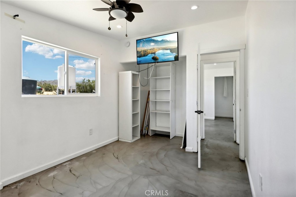 51474 Mills Road Johnson Valley, CA 92285 - Photo 21 of 56 wooden floor in an empty room with a window