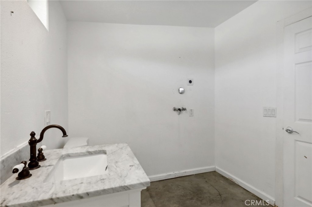 51474 Mills Road Johnson Valley, CA 92285 - Photo 27 of 56 a bathroom with a sink and vanity