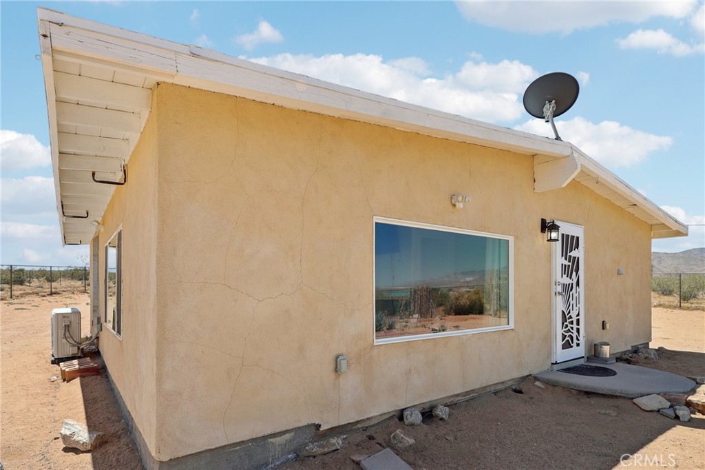51474 Mills Road Johnson Valley, CA 92285 - Photo 7 of 56 a front view of a house with a window