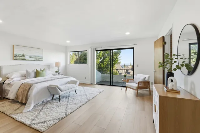 a bathroom with a granite countertop sink a mirror and shower