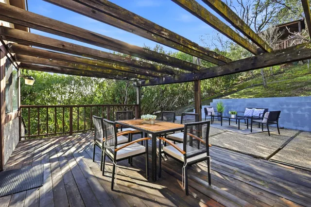 an aerial view of residential house with outdoor space and trees