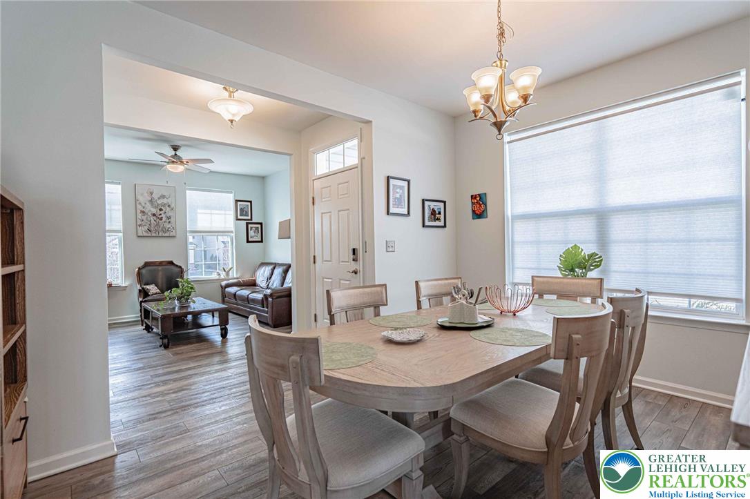 4435 Stole Road Emmaus, PA 18049 - Photo 11 of 64 a view of a dining room with furniture wooden floor and chandelier
