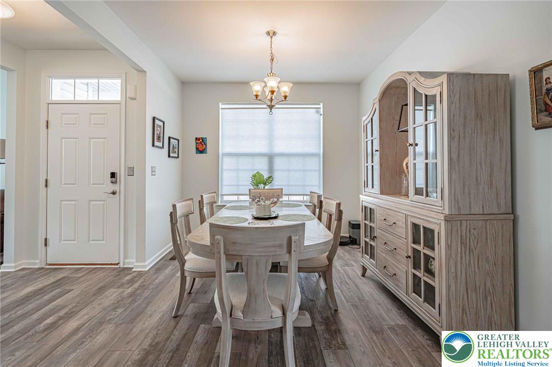 4435 Stole Road Emmaus, PA 18049 - Photo 12 of 64 a view of a a dining room with furniture window and wooden floor