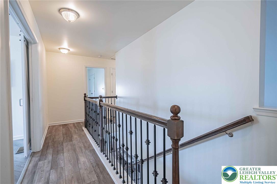 4435 Stole Road Emmaus, PA 18049 - Photo 27 of 64 a view of a hallway with wooden floor and staircase