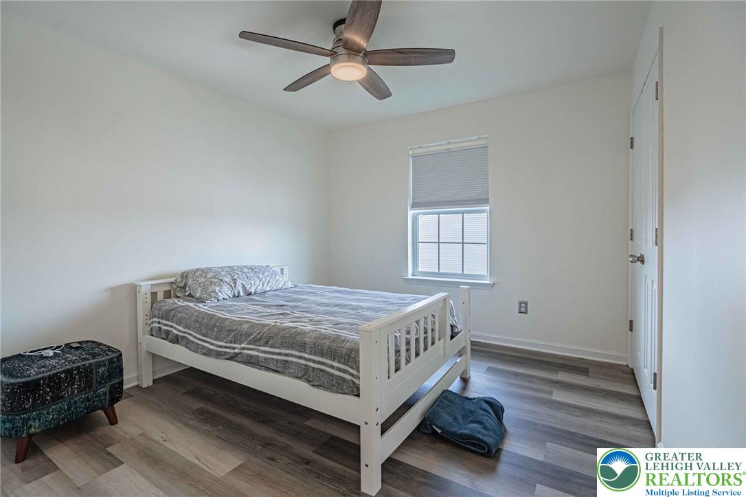 4435 Stole Road Emmaus, PA 18049 - Photo 39 of 64 a bedroom with a bed and wooden floor