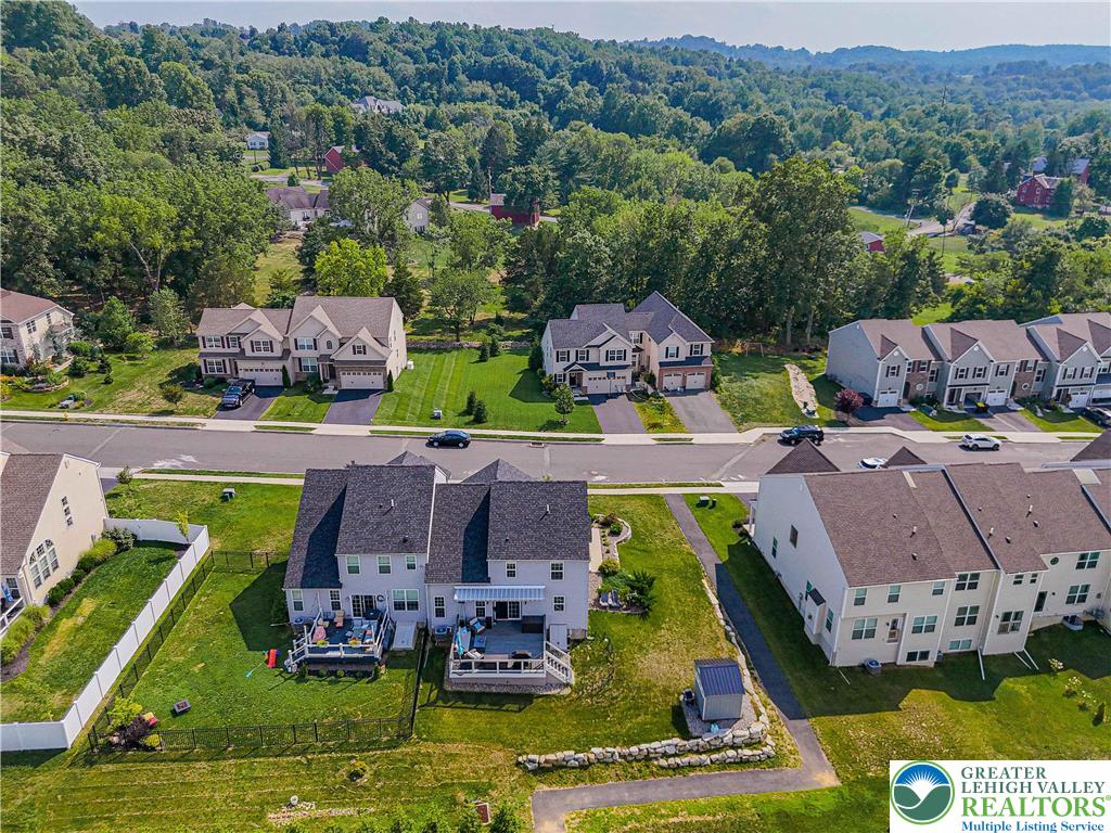 4435 Stole Road Emmaus, PA 18049 - Photo 64 of 64 an aerial view of a house with a garden potted plants and large trees