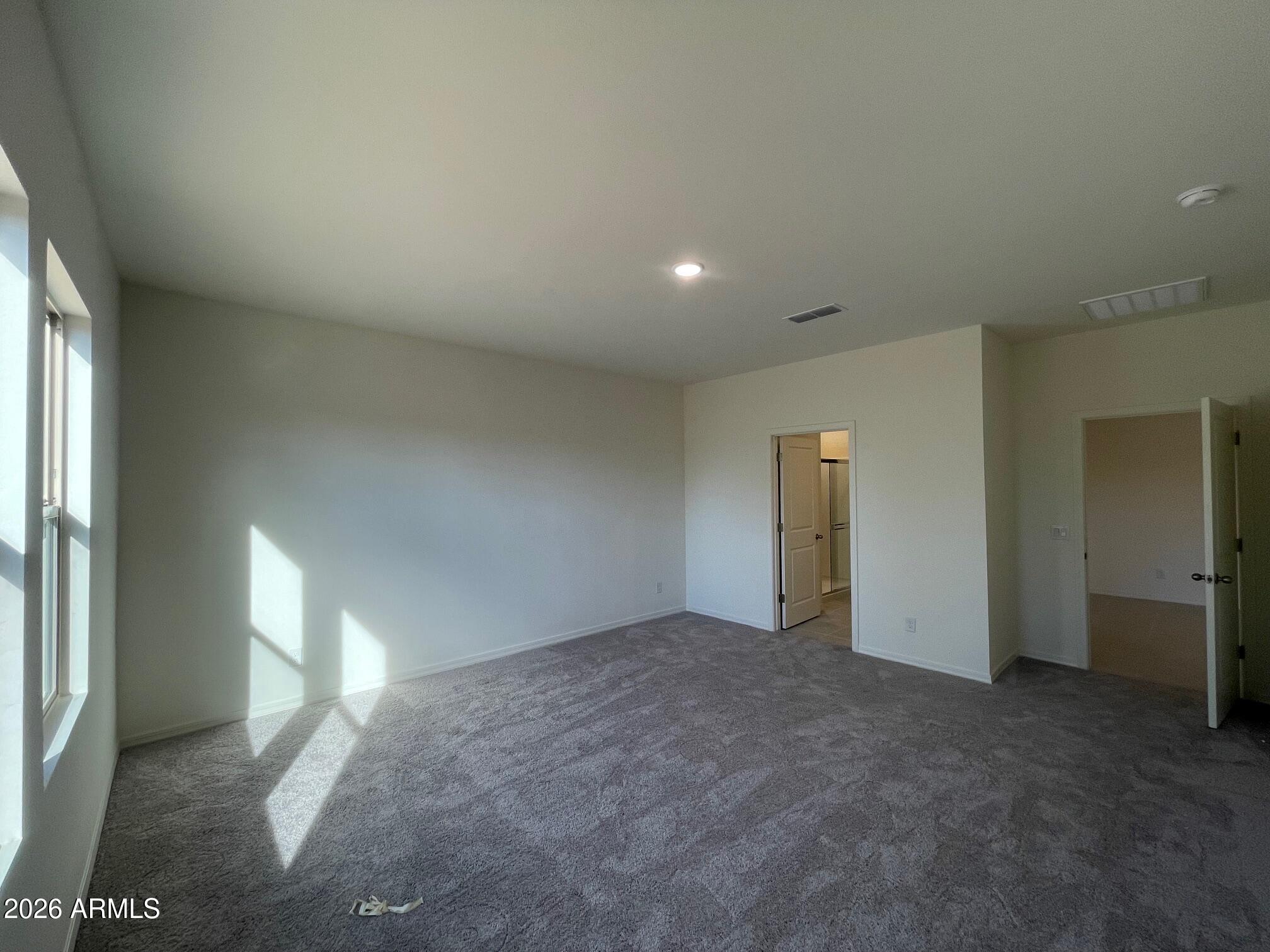 2152 Night Rider Road San Tan Valley, AZ 85140 - Photo 6 of 11 an empty room with a empty space and a window