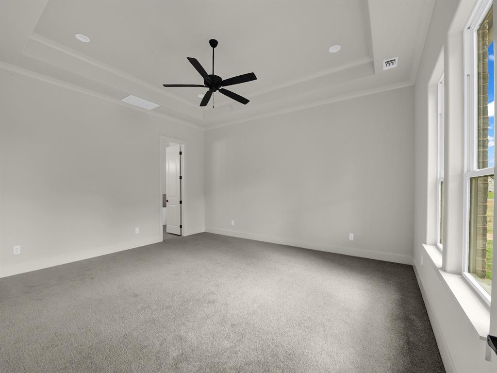 305 Wrangler Court Weatherford, TX 76088 - Photo 24 of 32 a view of a livingroom with a ceiling fan and window