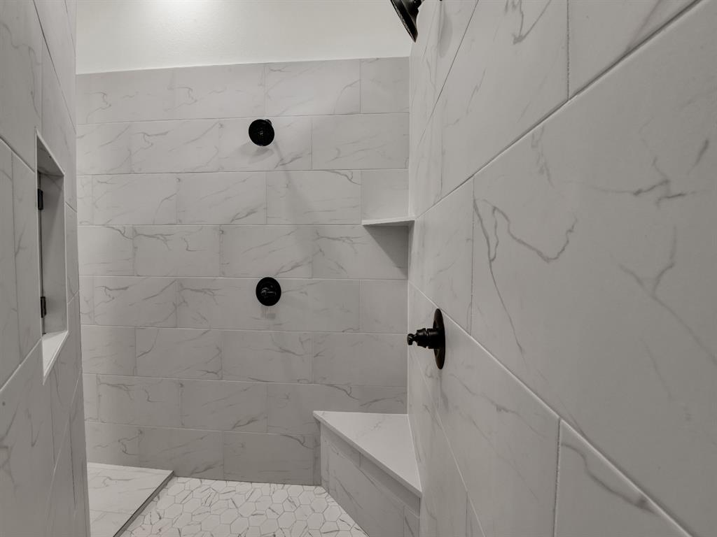 305 Wrangler Court Weatherford, TX 76088 - Photo 29 of 32 a bathroom with a shower