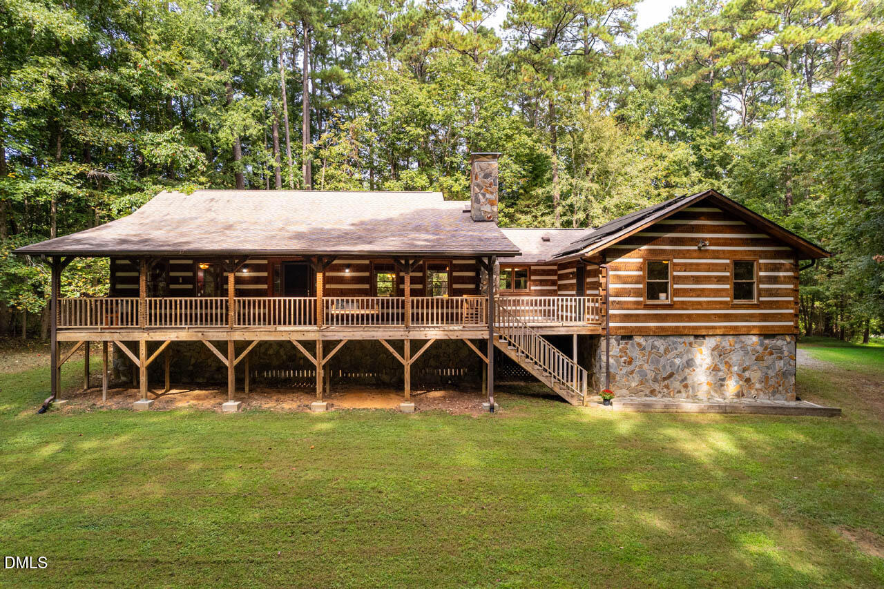 1114 Phil's Ridge Road Chapel Hill, NC 27516 - Photo 1 of 52 a front view of a house with garden