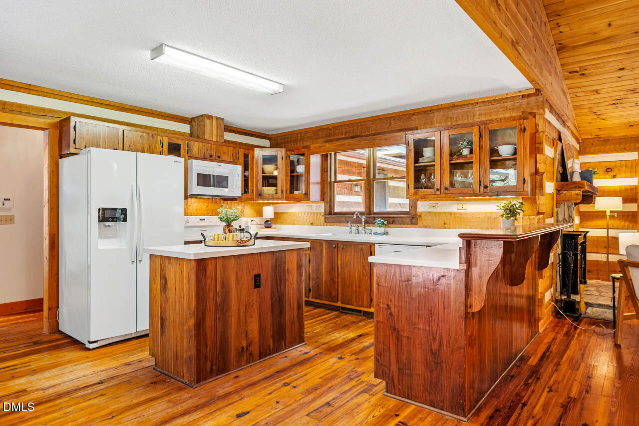 1114 Phil's Ridge Road Chapel Hill, NC 27516 - Photo 14 of 52 a kitchen with stainless steel appliances granite countertop a refrigerator and a stove top oven