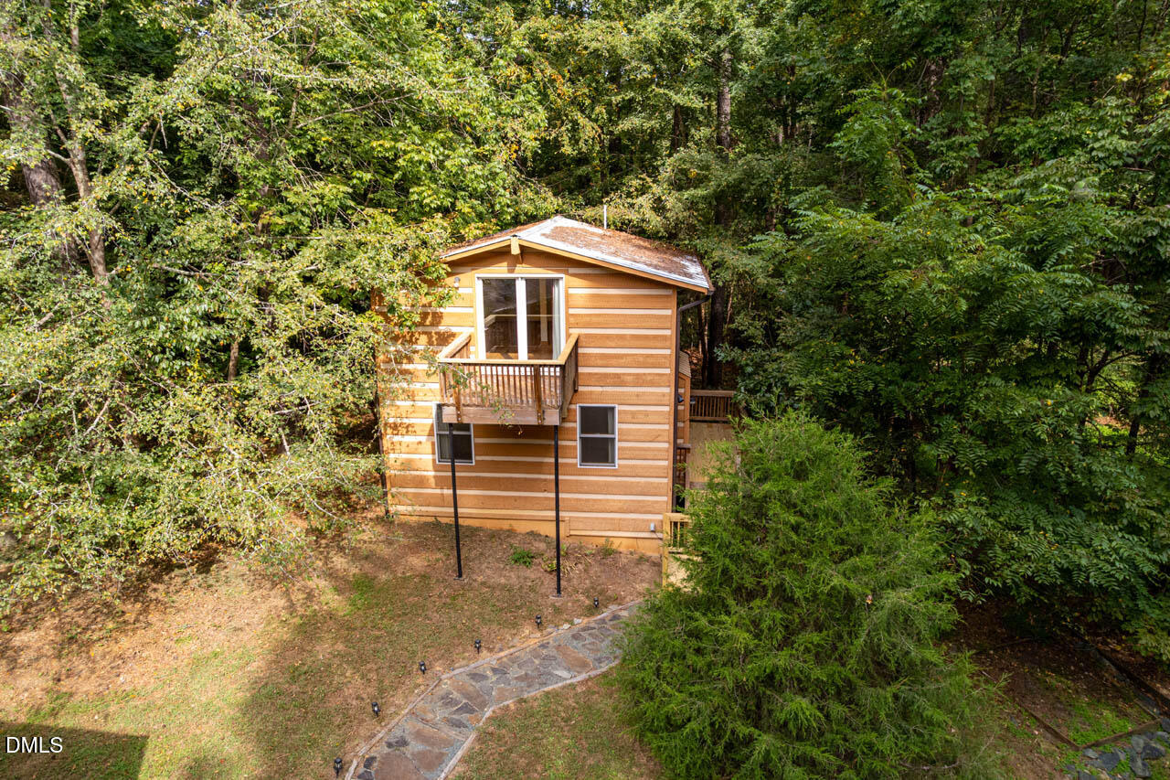 1114 Phil's Ridge Road Chapel Hill, NC 27516 - Photo 2 of 52 a house view with a outdoor space
