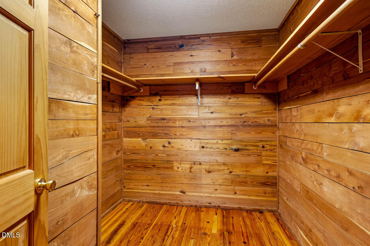 1114 Phil's Ridge Road Chapel Hill, NC 27516 - Photo 23 of 52 a view of room with wooden floor